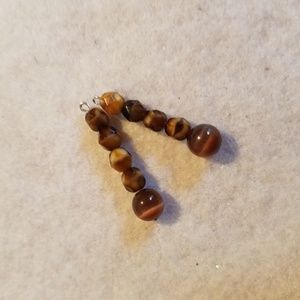 NWOT. Brown Earring